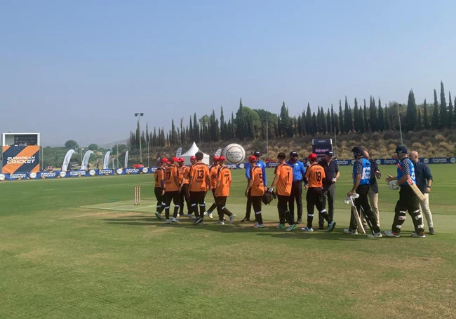 The players enter the field ahead of the opener.