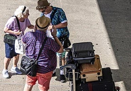 Tourists arriving at an airport in Spain.