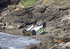 Wrecked car on the beach of Torremuelle.