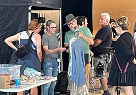 Actress Robin Wright choosing wardrobe details before filming.