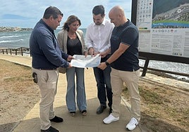 Ana Mata studies the plans for coastal path extension.