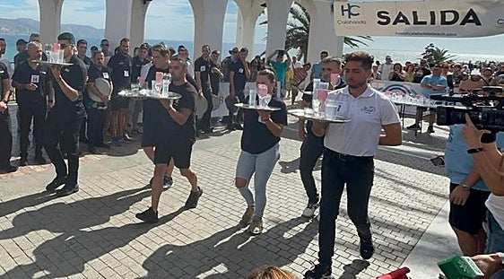 Watch as waiting staff race around iconic Costa del Sol landmark to win big cash prizes