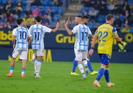 Kevin congratulates Dioni after he scored Malaga's first goal in Cadiz.