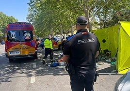 Emergency crews attend to a man in Madrid who died of heat stroke.