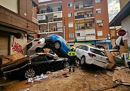 Firefighters from Malaga search for victims among a mountain of twisted vehicles after the 'Dana' storm caused a huge loss of life in Valencia.