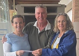 Alan Boardman hands over the cheque.