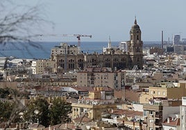 Views of Malaga Cathedral with the construction cranes.