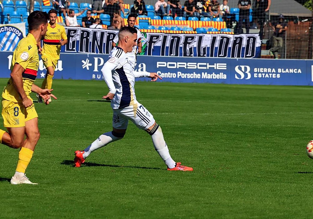 Marbella's José Callejón lays the ball off to a teammate.