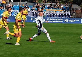 Marbella's José Callejón lays the ball off to a teammate.