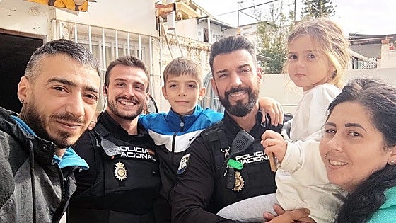 Two brave police officers rescue family trapped by rising flood water in their Malaga home