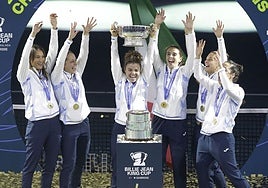 The Italy players celebrate with the trophy on Wednesday night.
