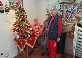 Carol Baxter and Claudio Castellon with some of the presents already donated.
