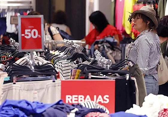 File image of a shopper at sale time.