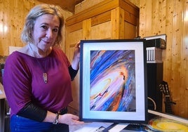 Blanca Troughton shows the artwork Una del triplete de Leo (One of Leo's triplets) in her studio in Torremolinos.