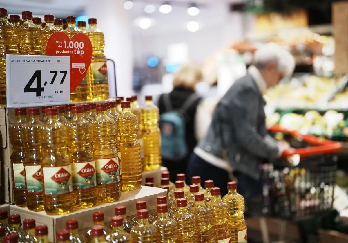 Bottles of olive oil on supermarket shelves in Spain.