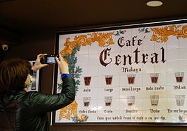 File image of a tourist photographing the tile display before the popular establishment closed its doors.