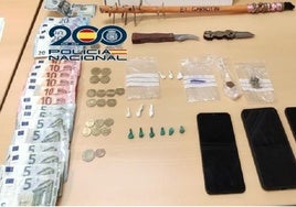 Cash and drugs seized from the suspect's house.