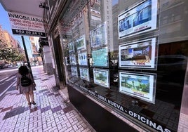 Shop window of a real estate agency on a street in Malaga