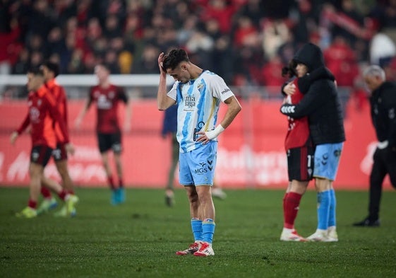 Malaga goalscorer David Larrubia, disappointed at the final whistle.