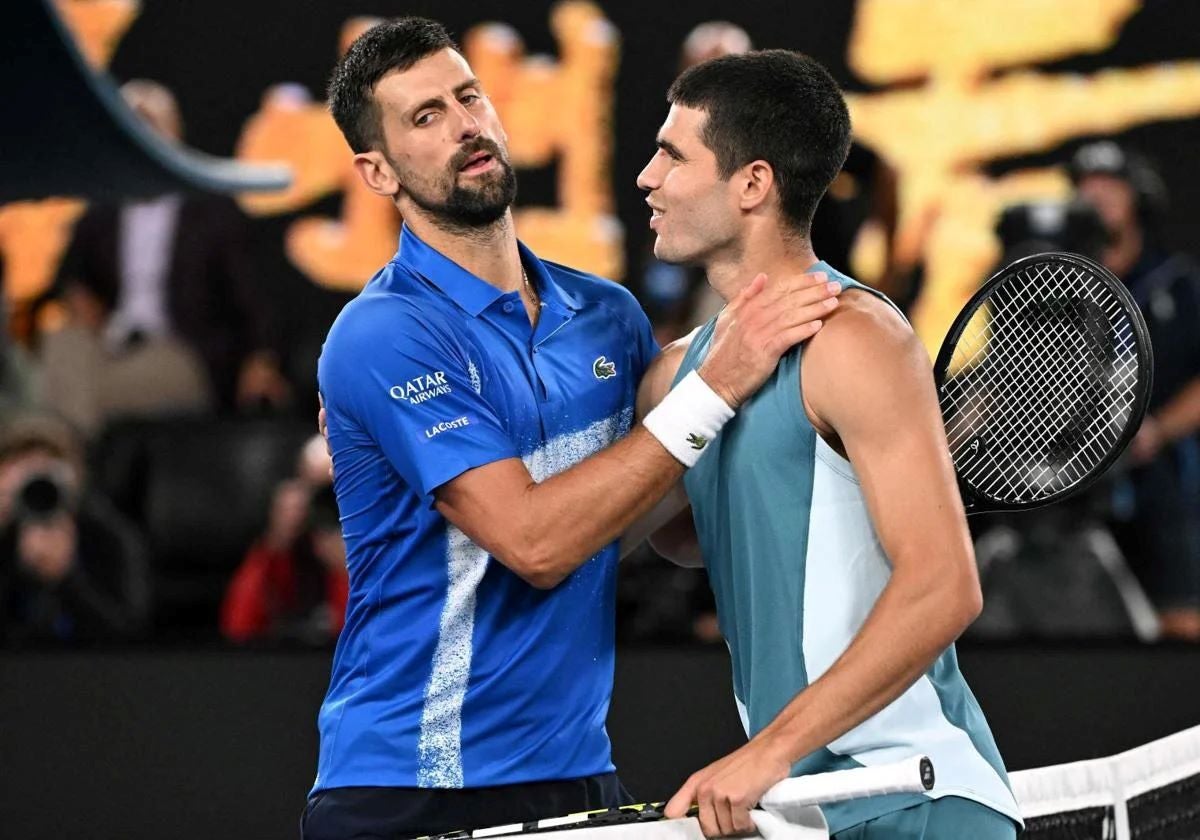 Novak Djokovic and Carlos Alcaraz embrace after the match.