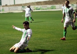 Carrión slides on his knees to celebrate scoring Antequera's winning goal.