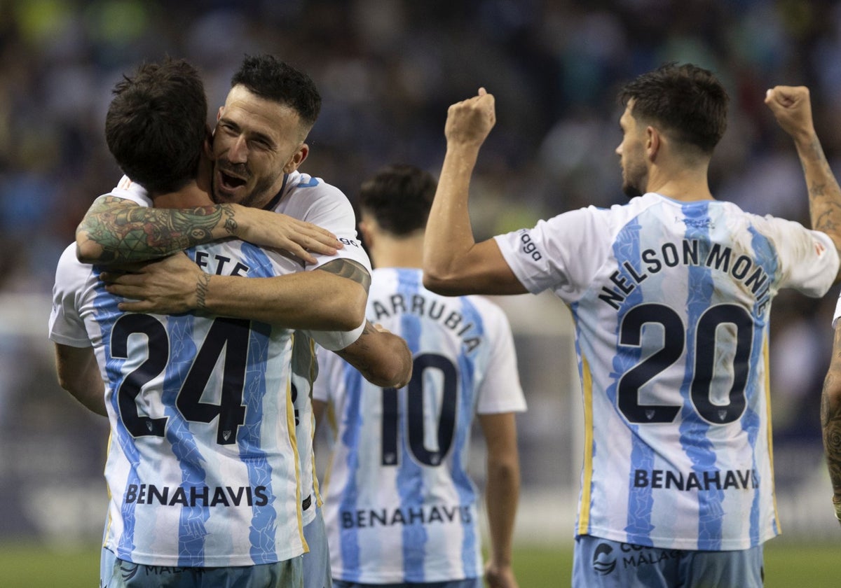 Dioni celebrates putting Malaga ahead with Lobete, who laid on the goal.