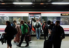 Passengers at a Cercanías station in Malaga.