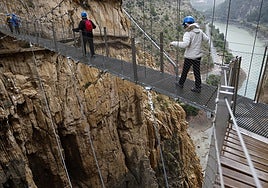 File image of visitors crossing the existing suspension bridge that spans the vertical walls of the gorge.