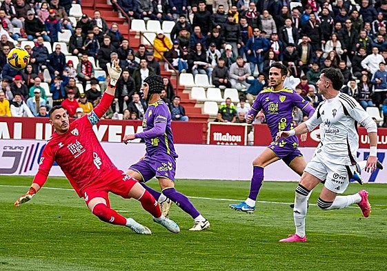 Albacete's Morcillo, right, dinks the ball over keeper Herrero to make it 2-0.
