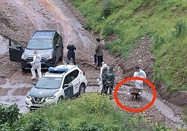 The Guardia Civil inspecting the area where Paco's body was found and the wheelbarrow in which one of the arrested men stated that they transported him.