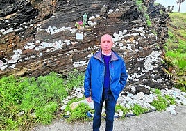 Francisco L. Guerrero, better known as Fray, in front of the image.