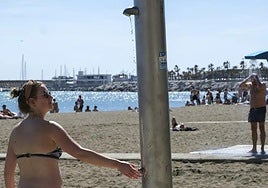 File image of showers on La Malagueta beach in the capital of the Costa del Sol.