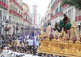 The Señor de la Pollinica procession makes its way down Calle Larios.