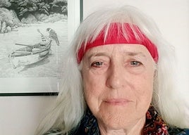 Michèle Savelle with one of her paintings.