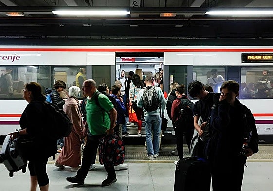 Rail passengers using a Cercanías train on the existing line between Malaga city and Fuengirola.