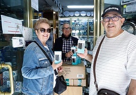 Buying old-fashioned battery-operated radios in a shop on Union Street.