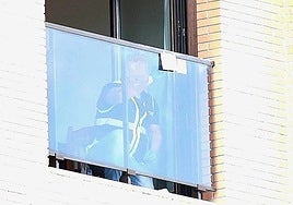 A police officer at the crime scene, after the discovery of the woman's body on the street.