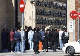 A large group of friends and family of the victim at the funeral.