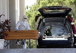 A funeral home employee at work during the Covid pandemic.