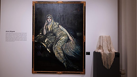 Anita Delgado's shawl and other historic silk garments, displayed in Malaga Museum