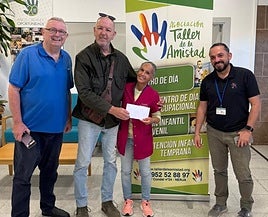 The handing over of the cheque.