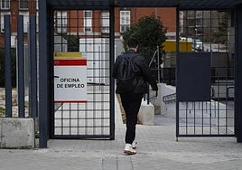 A young man entering an employment office.