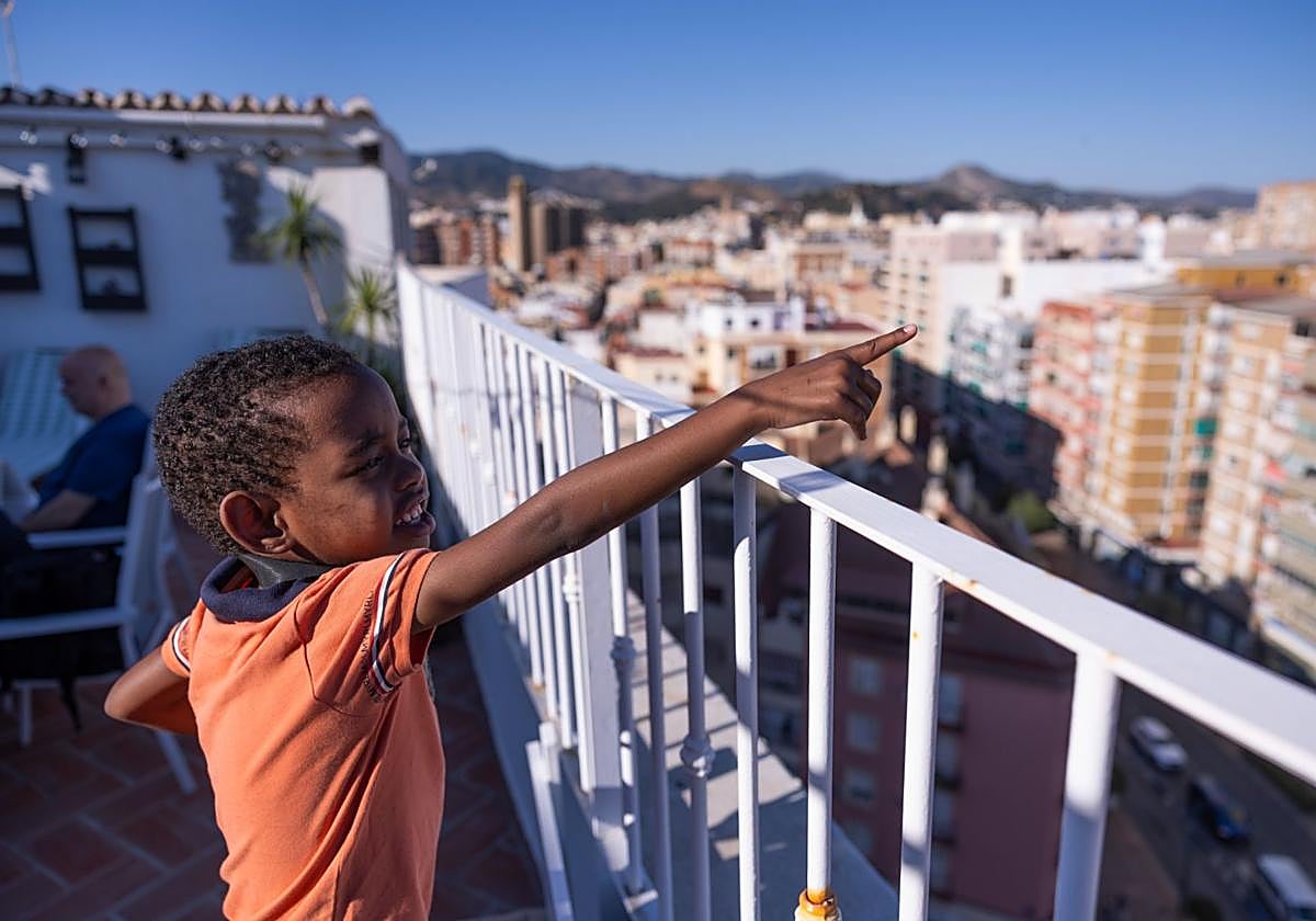 Alí on the balcony of the house of the family who took him and his mother in.