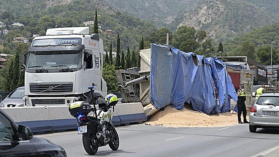 Chaos on the Costa as lorry loaded with sand overturns on one of the key access roads to Marbella
