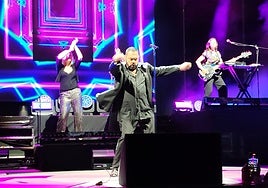 Singer Marian Gold in full swing on stage.