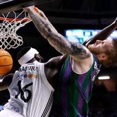 Real Madrid's Garuba fouls Unicaja's Balcerowski.