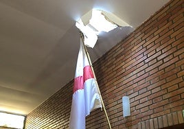 The hole in the ceiling of the church, through which the burglar entered.