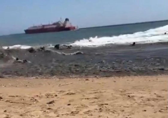Bathers being swept by the current at Playa del Vigía.