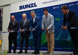 Authorities and Bunzl heads cut the ribbon at the logistics centre on Monday.