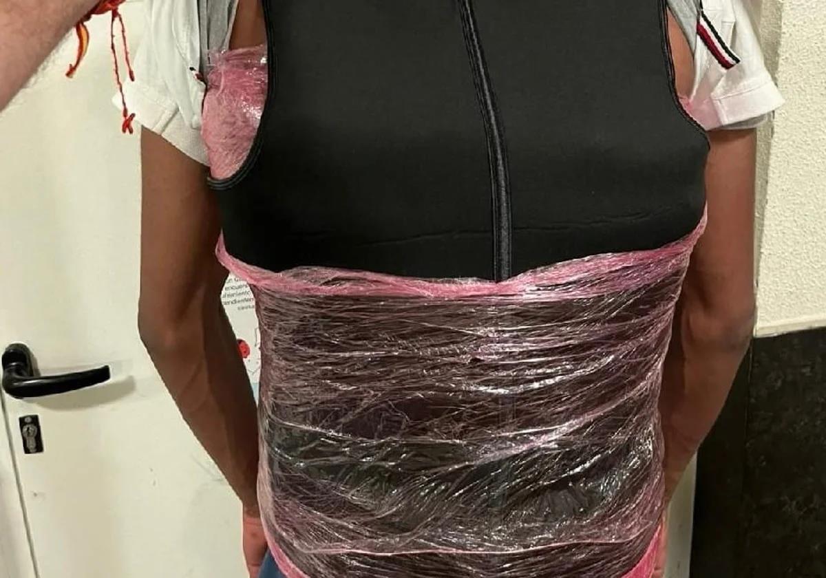 The detainee with the substances wrapped in plastic film.